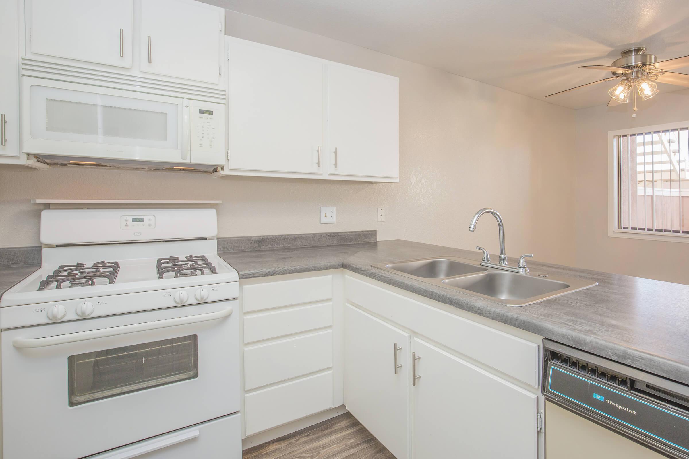 a kitchen with a stove and a sink