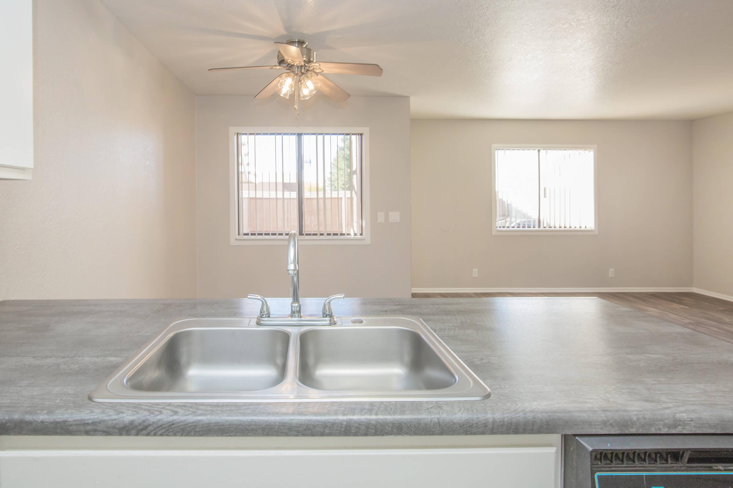 a kitchen with a sink and a window