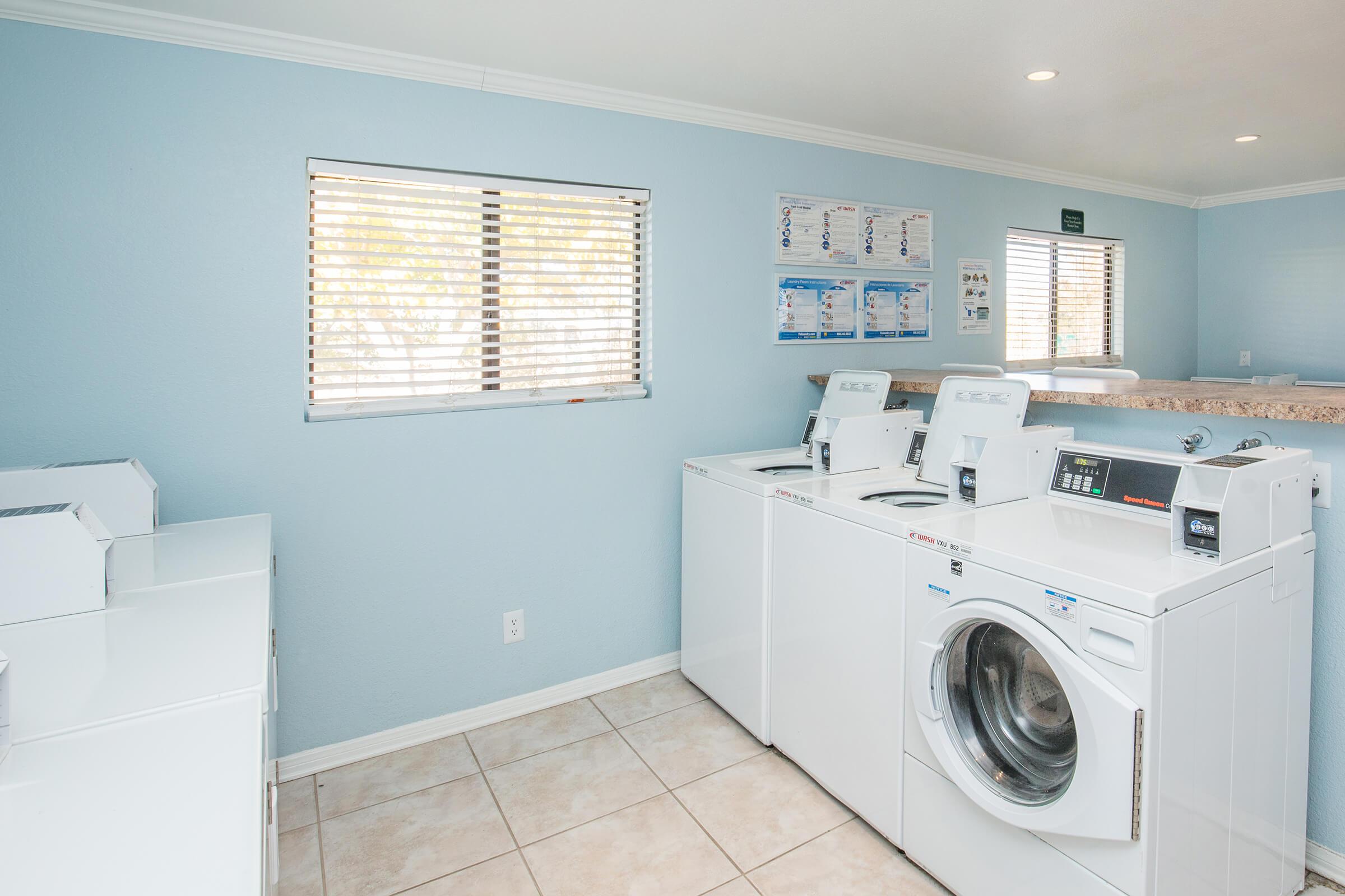 a white refrigerator freezer sitting inside of a kitchen