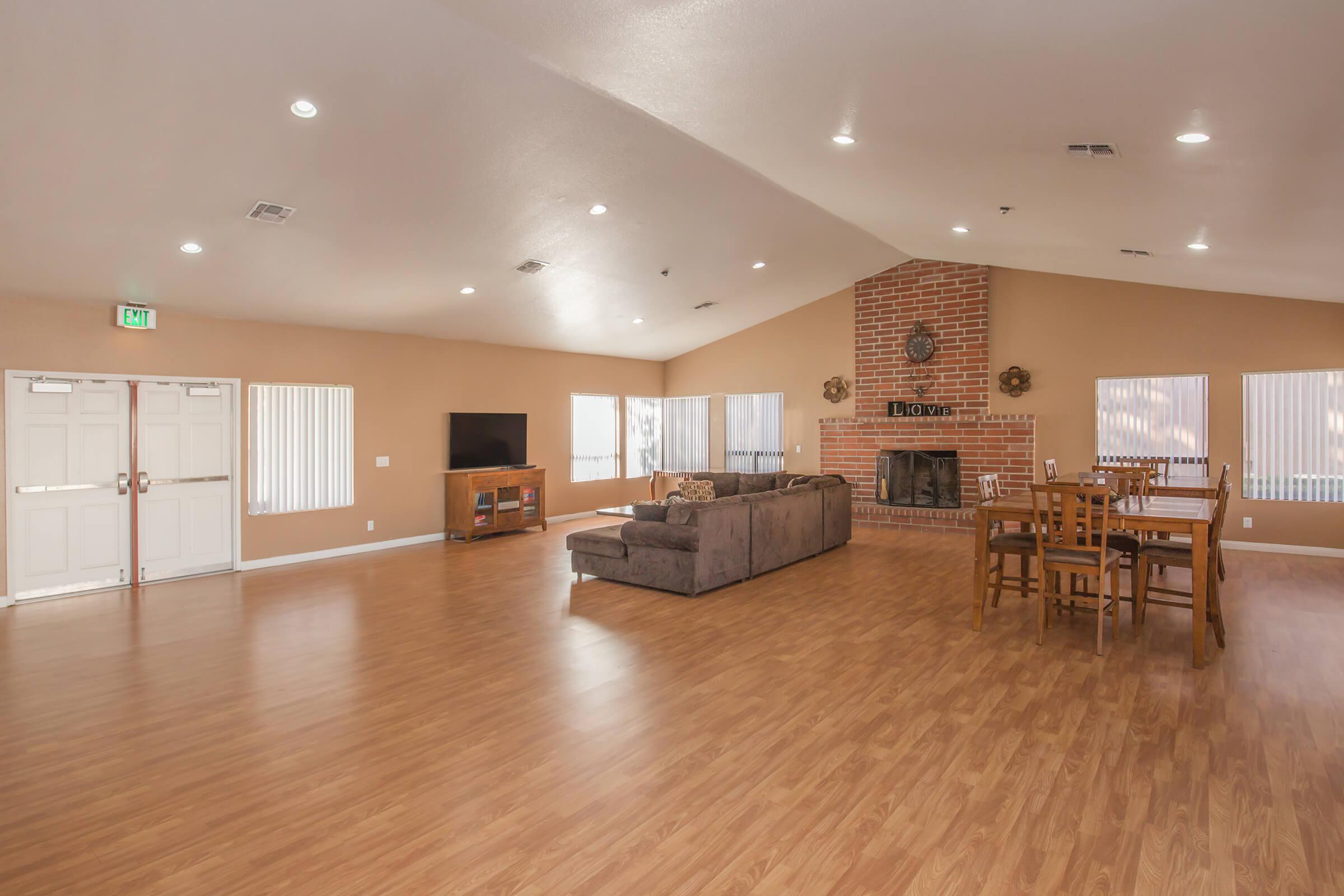 a room filled with furniture and a wood floor