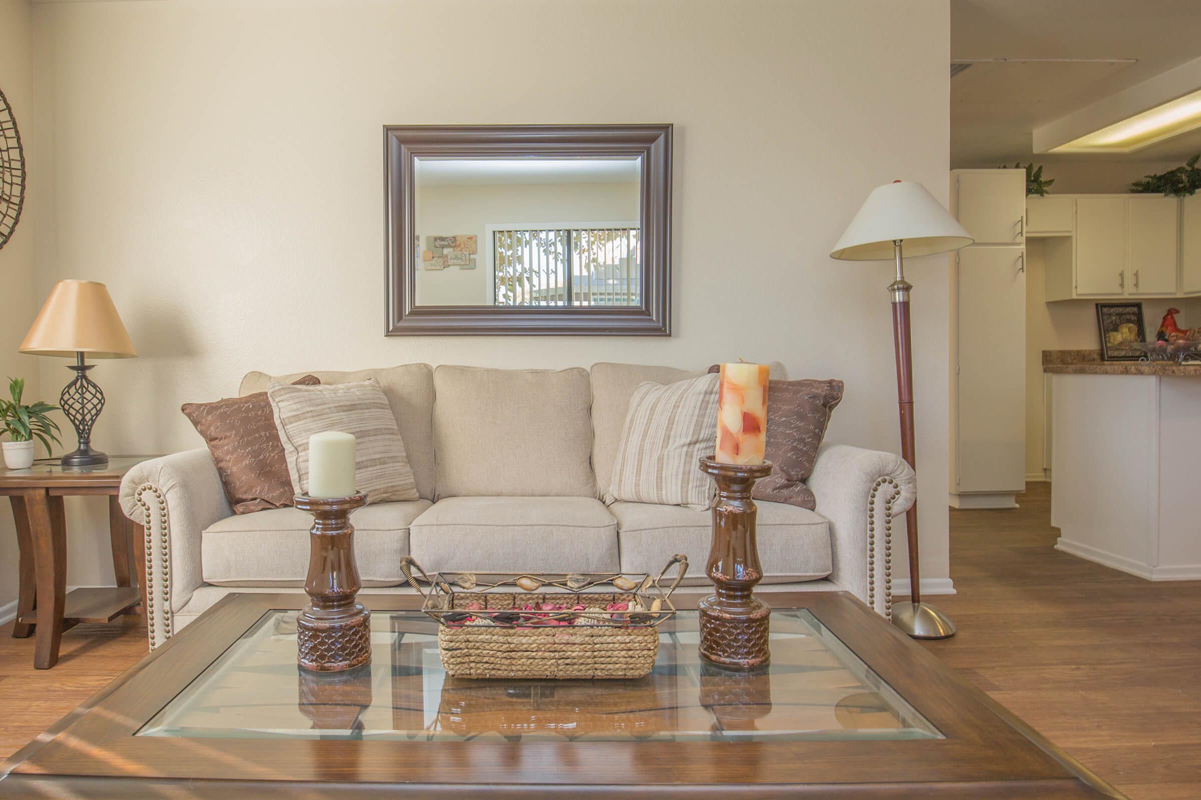 a living room filled with furniture and a fire place