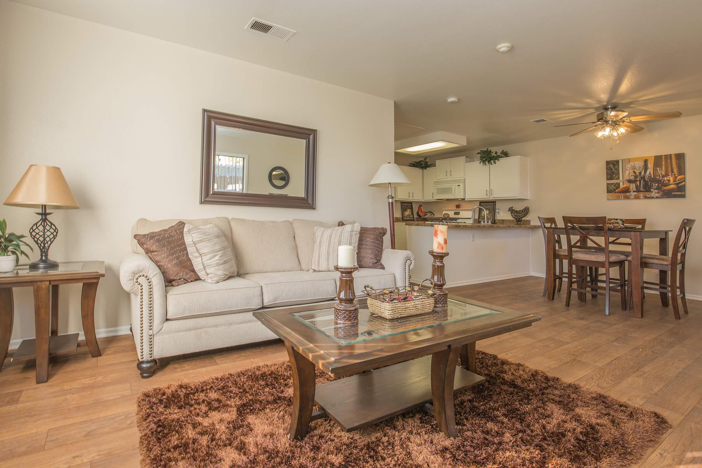 a living room filled with furniture and a fireplace