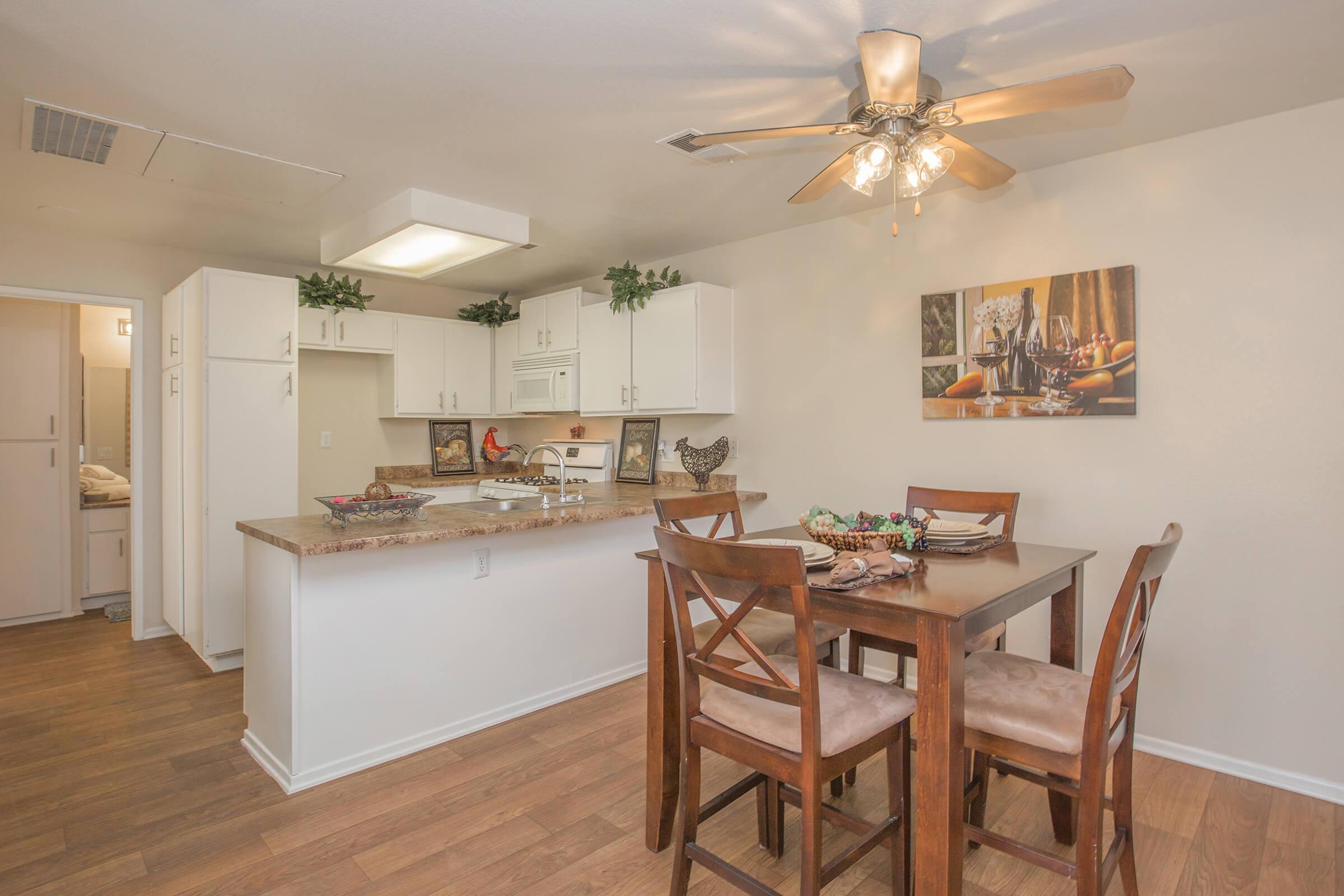 a kitchen with a dining room table