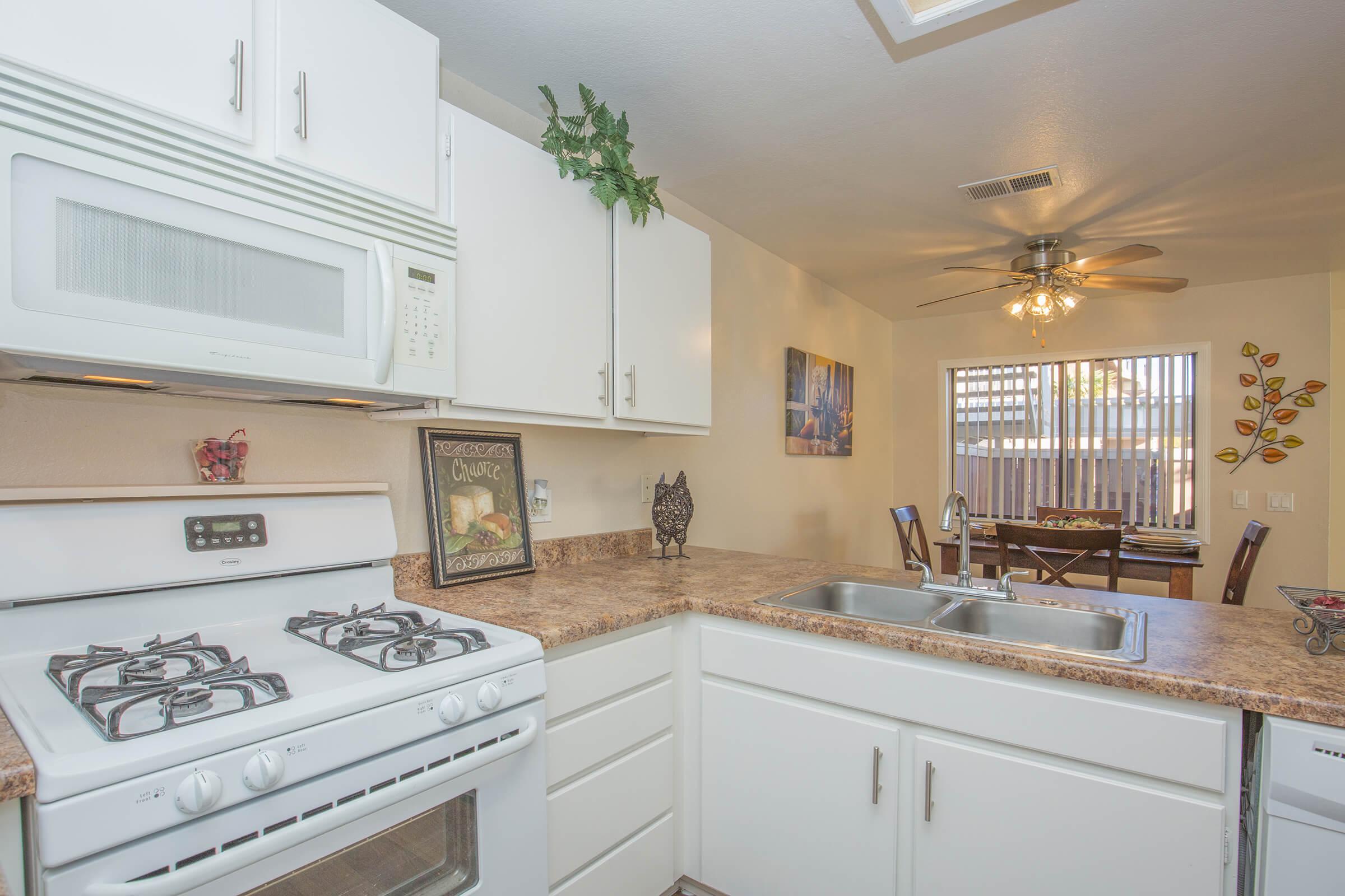 a kitchen with white cabinets