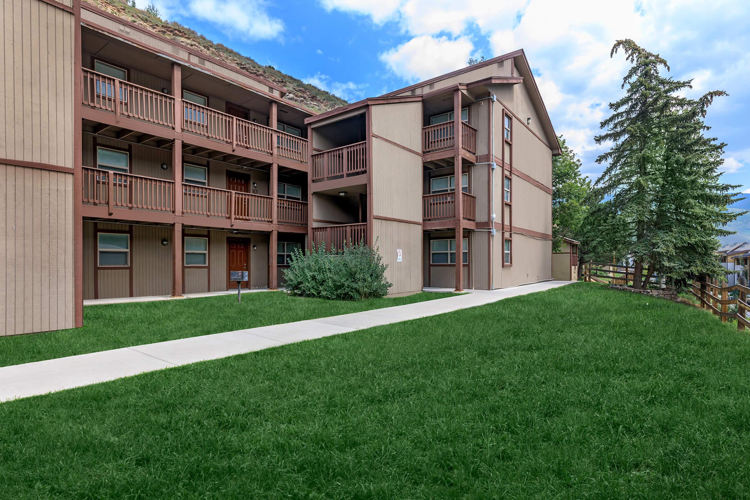 a large lawn in front of a building