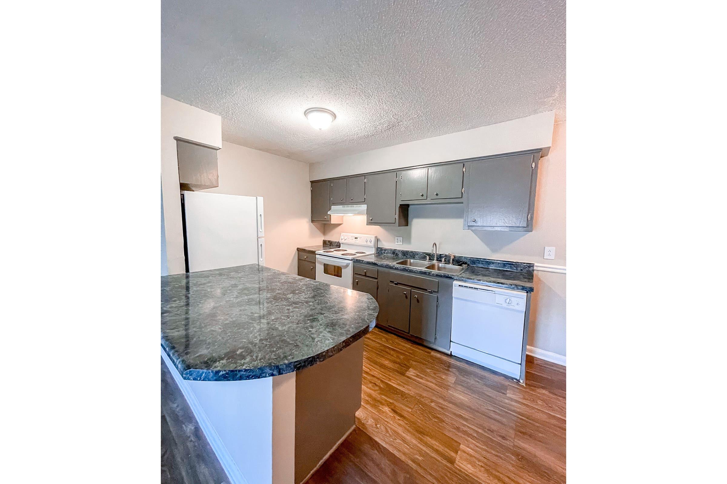 a kitchen with wooden cabinets