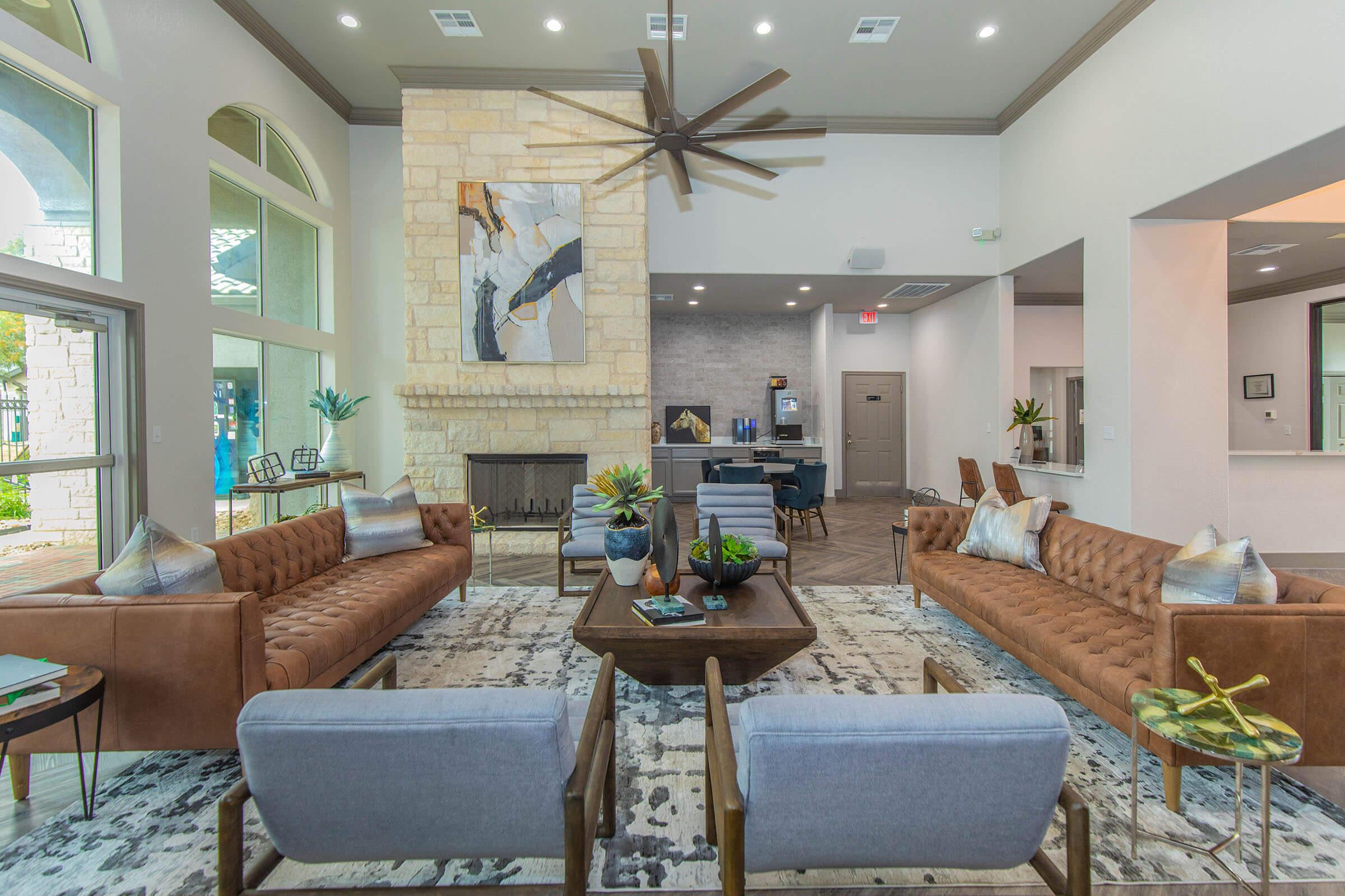 a living room filled with furniture and a large window