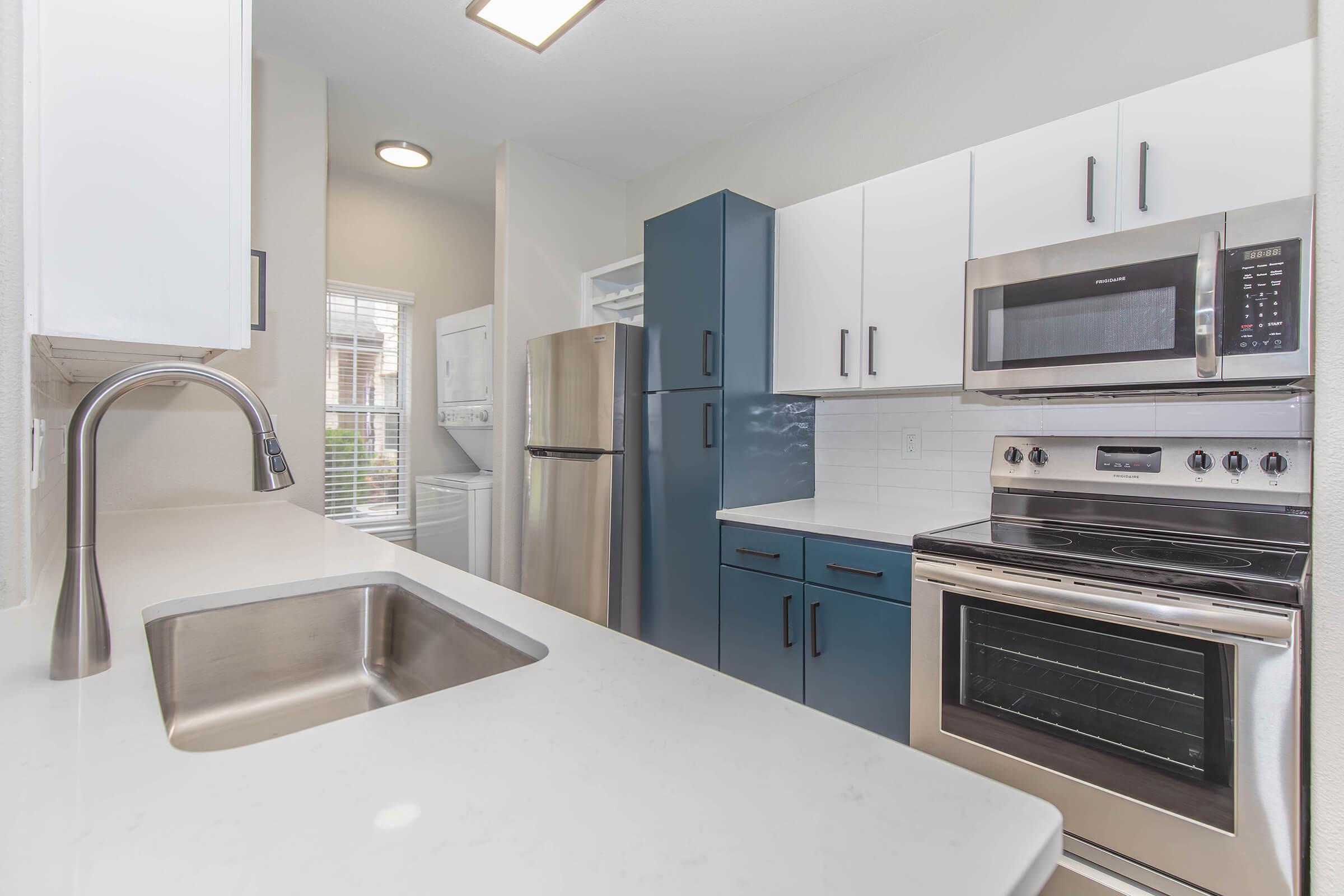 a kitchen with stainless steel appliances