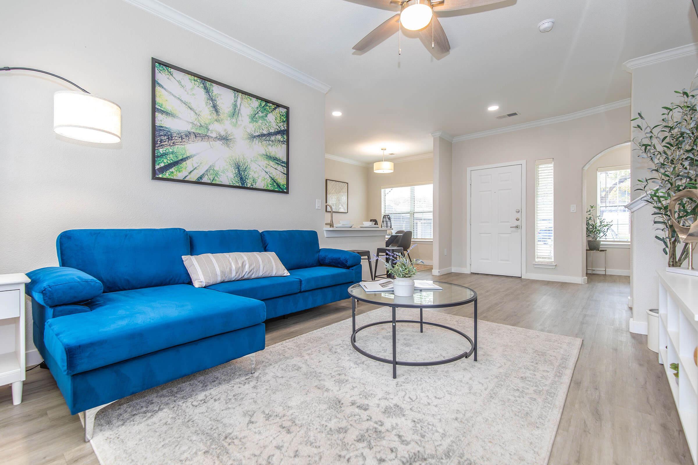 a living room filled with furniture and a rug