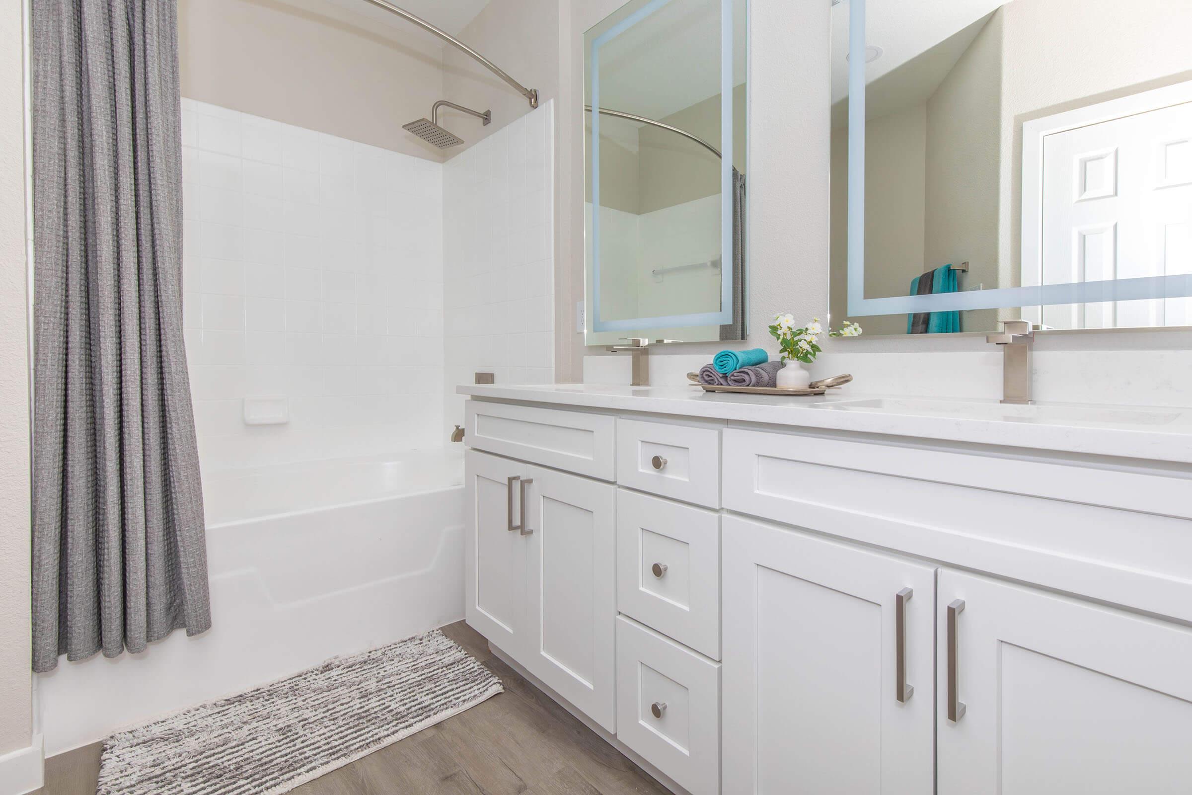 a kitchen with a sink and a mirror