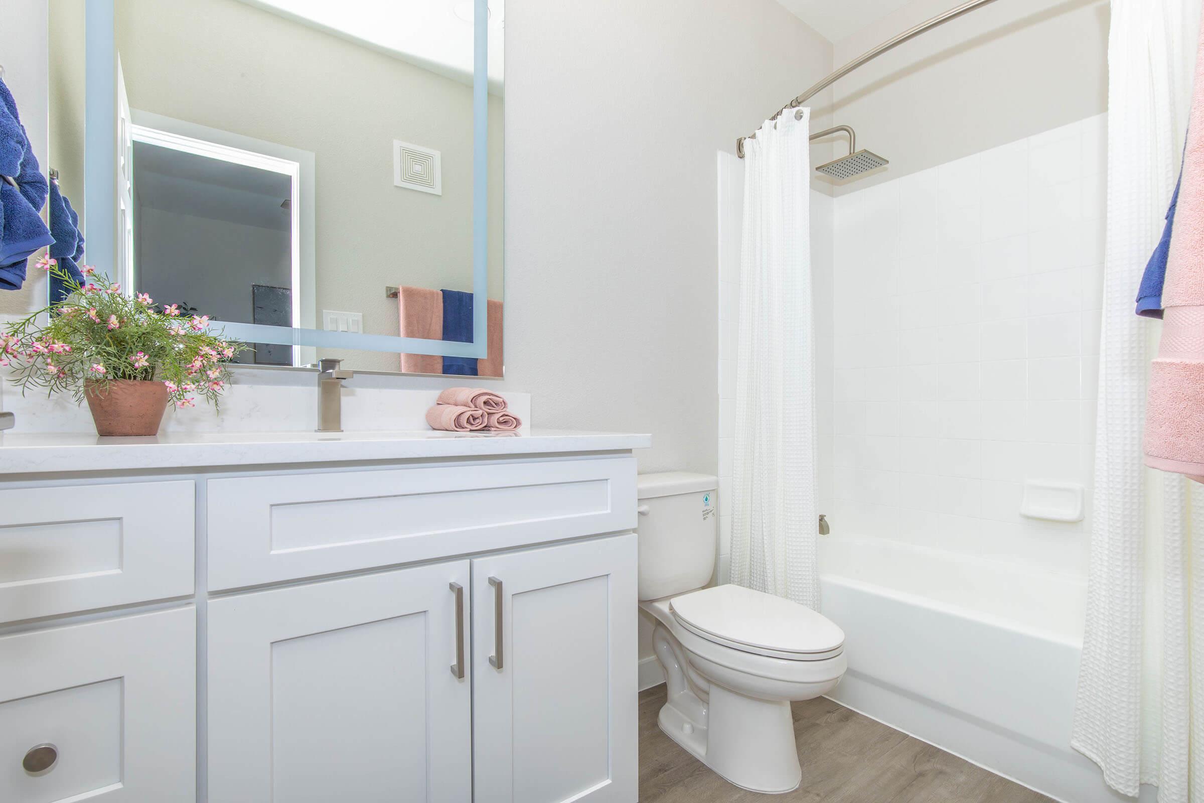 a kitchen with a sink and a mirror