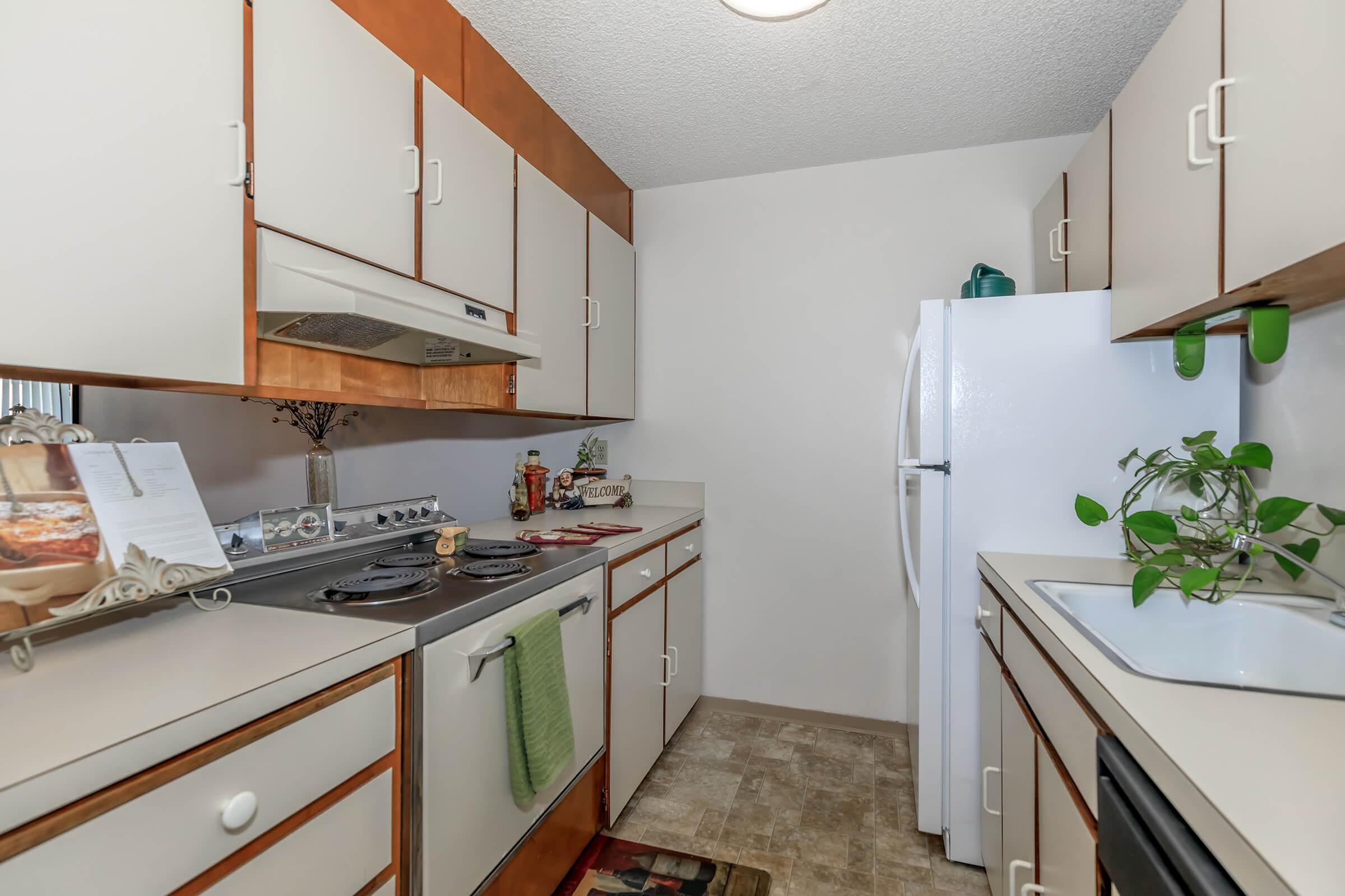 a kitchen with a sink and a mirror