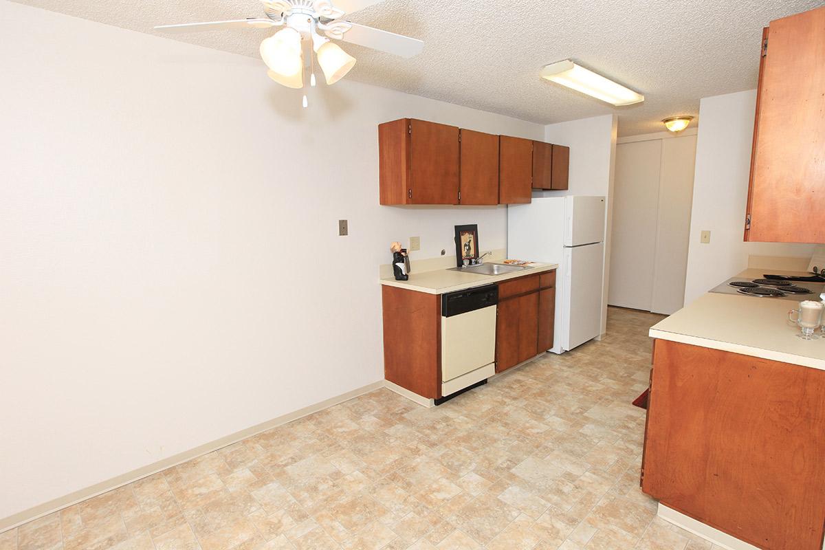 a kitchen with a sink and a refrigerator