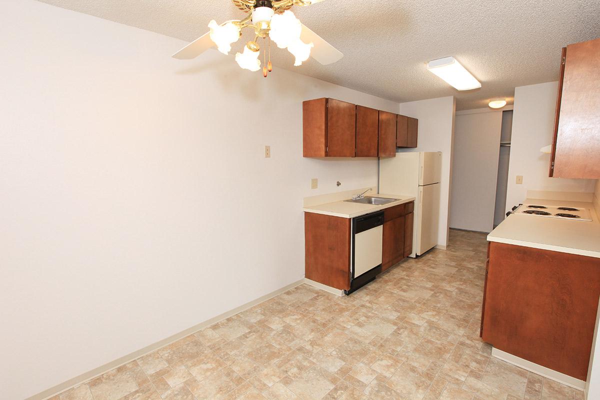 a kitchen with a wood floor