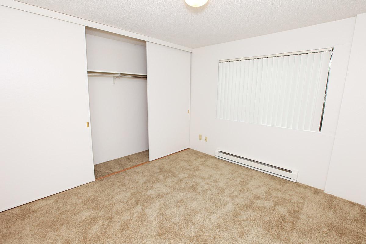 a white refrigerator freezer sitting inside of a room