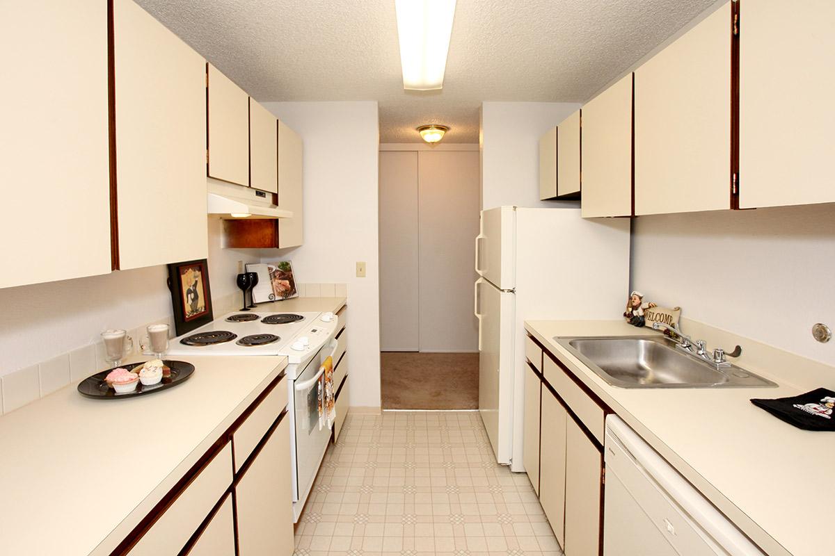 a kitchen with a stove and a sink