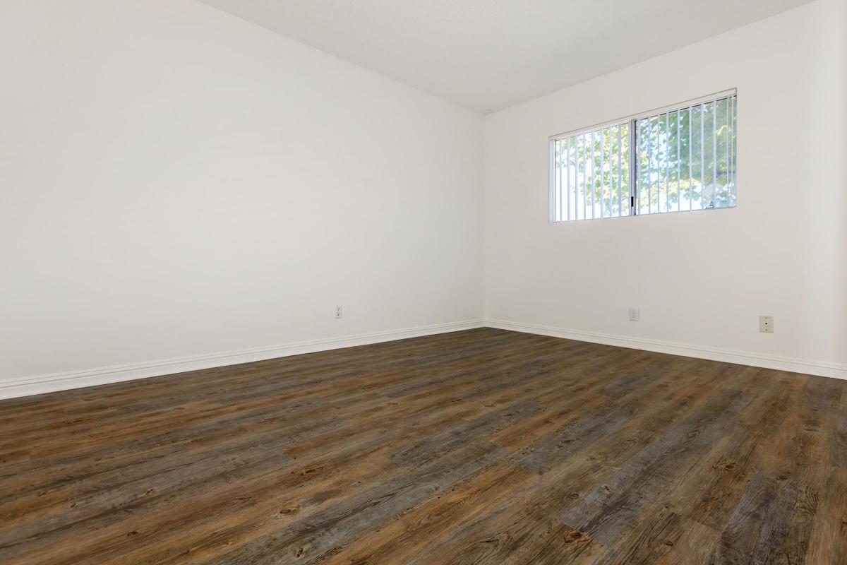 Bedroom with wooden floors
