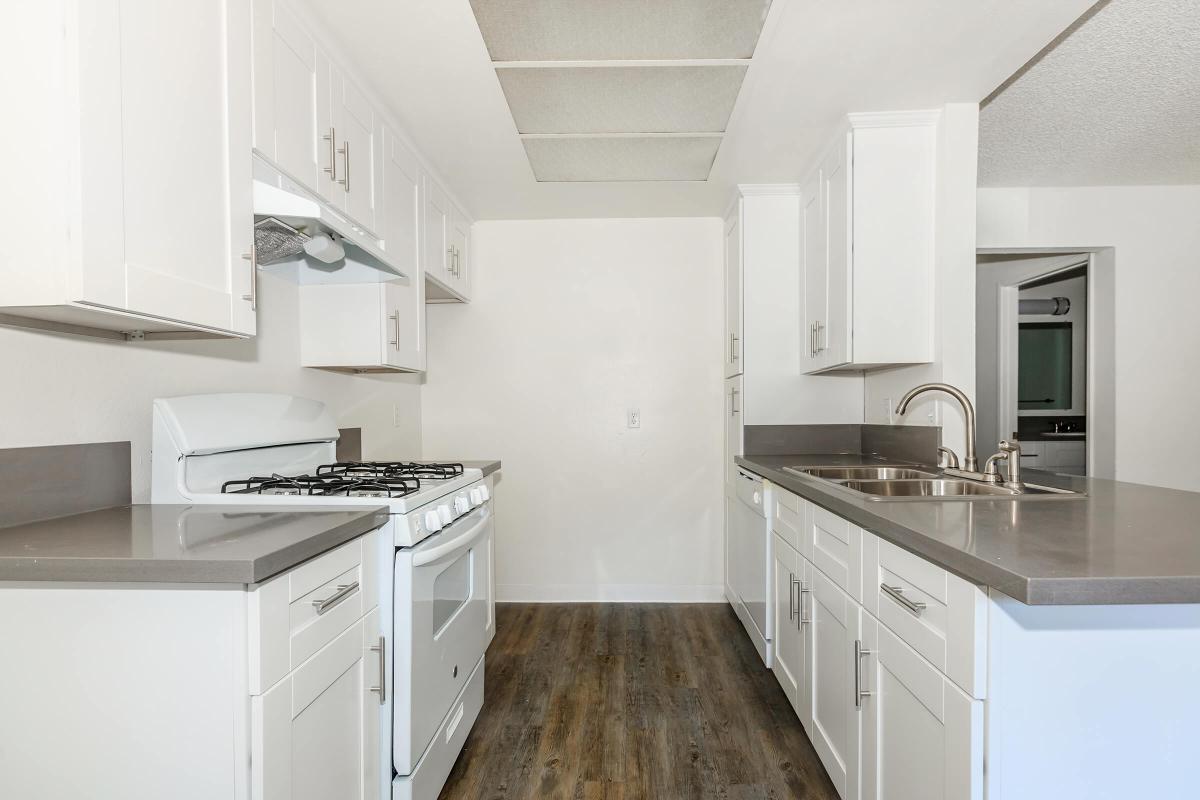 Unfurnished kitchen with white appliances