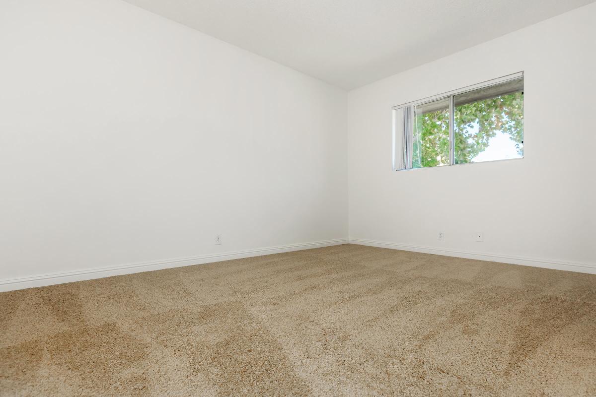 Unfurnished bedroom with open window