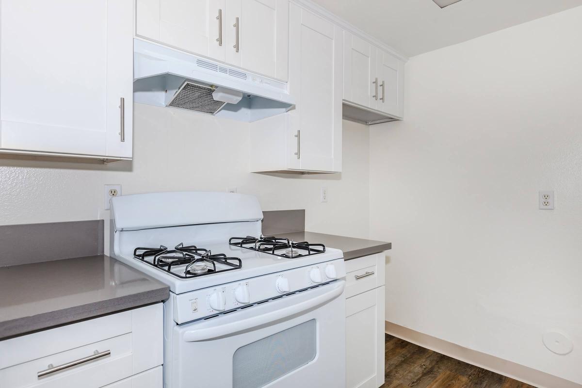 Unfurnished kitchen with a white stove