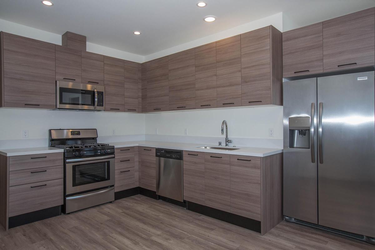 a large kitchen with stainless steel appliances