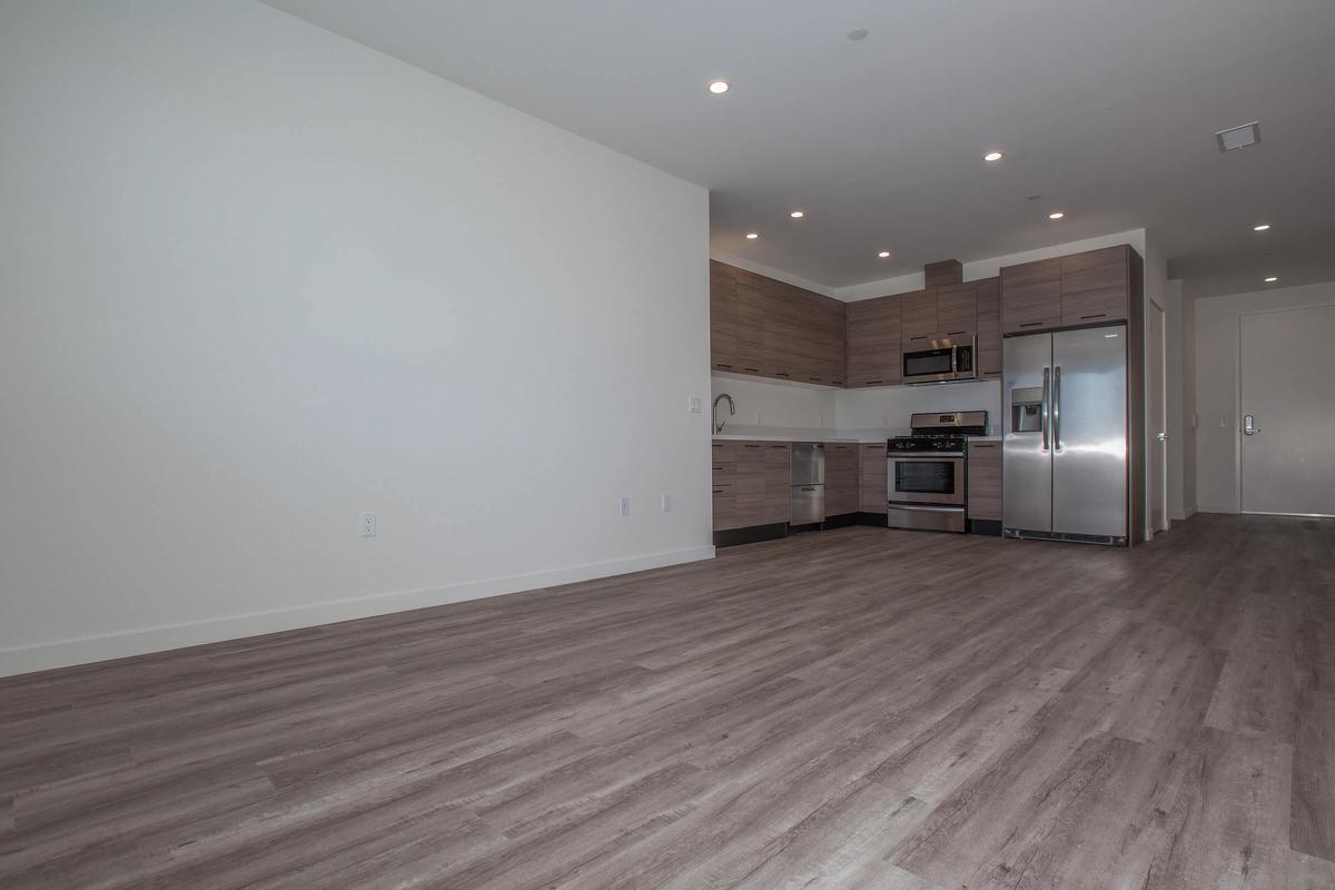 a large empty room with a wooden floor