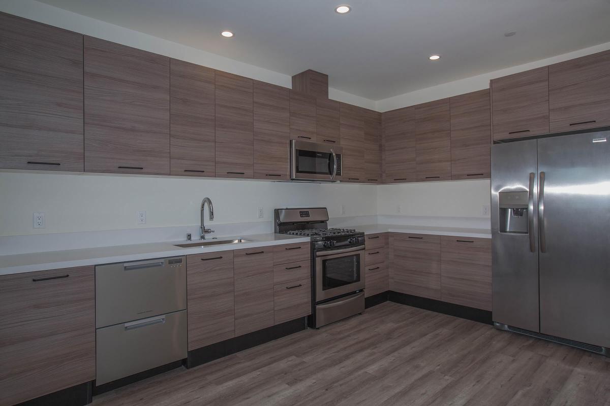 a large kitchen with stainless steel appliances
