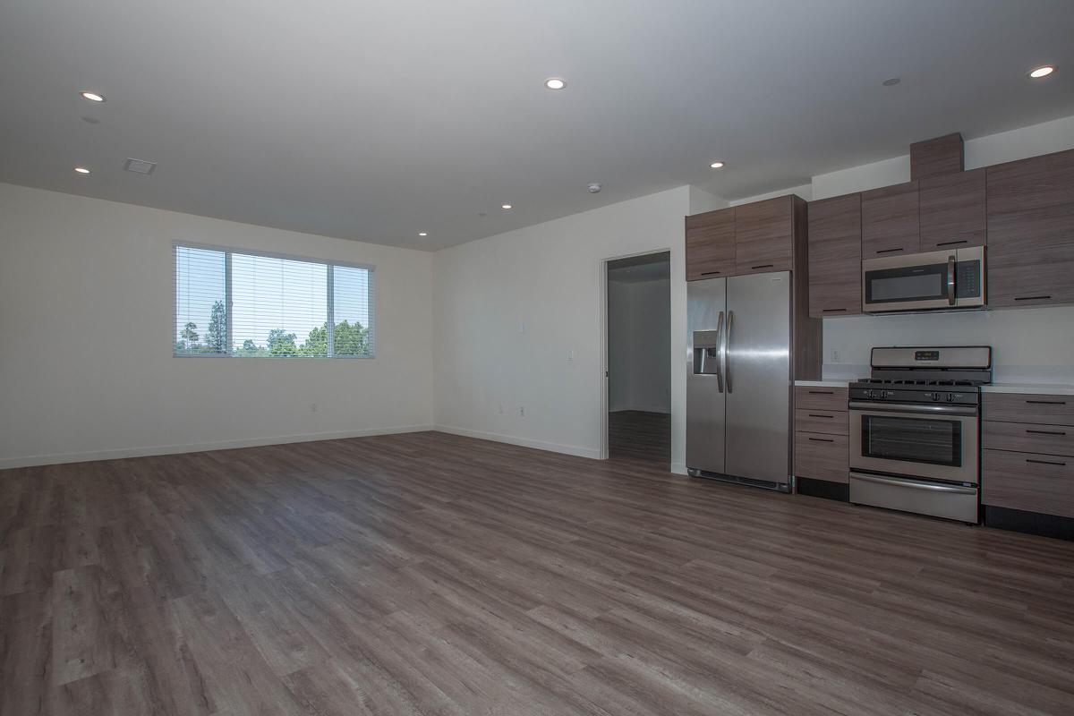 a kitchen with a wood floor