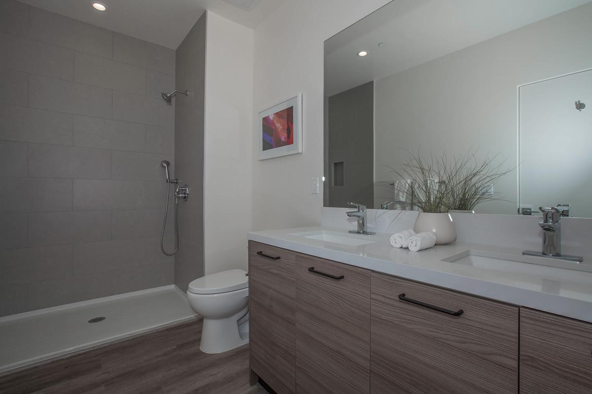 a room with a sink and a mirror