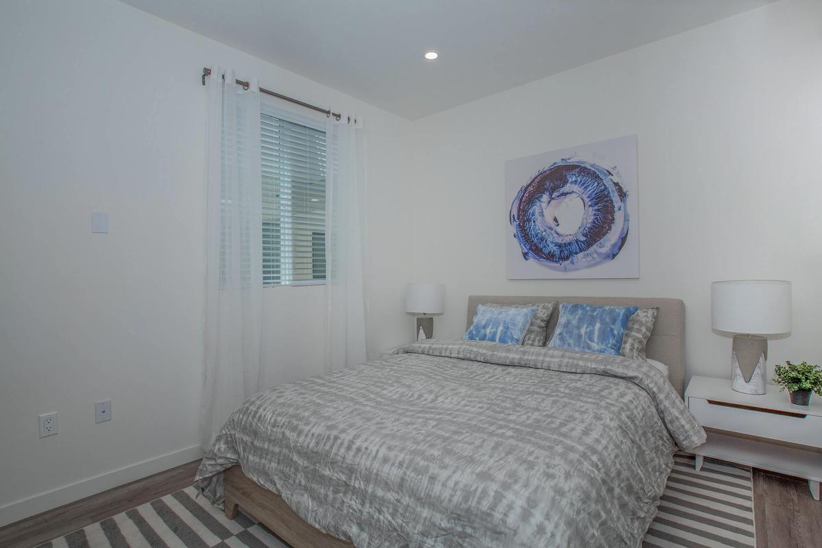 a bedroom with a bed in a room