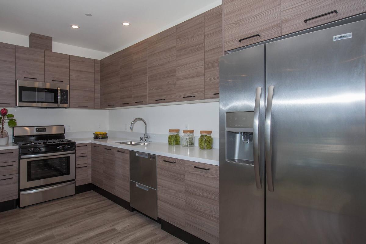 a stainless steel refrigerator in a kitchen