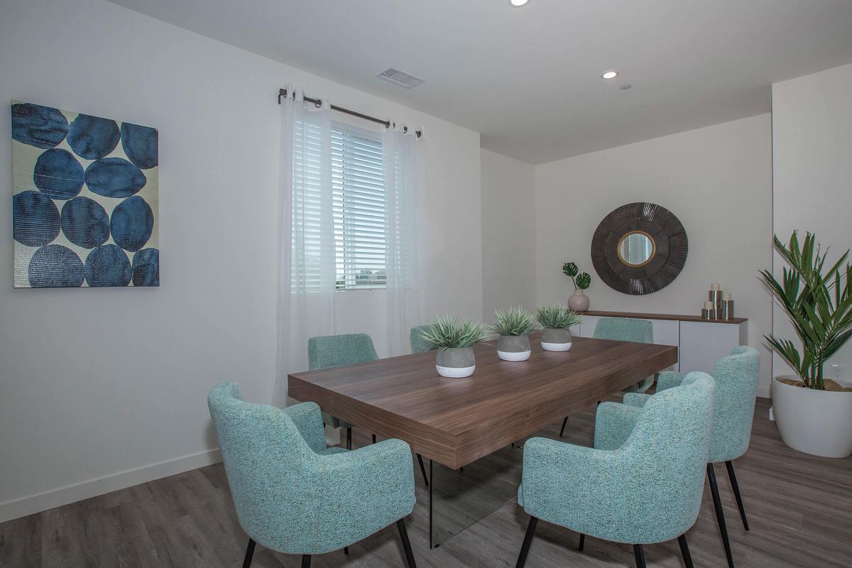 a living room filled with furniture and a large window