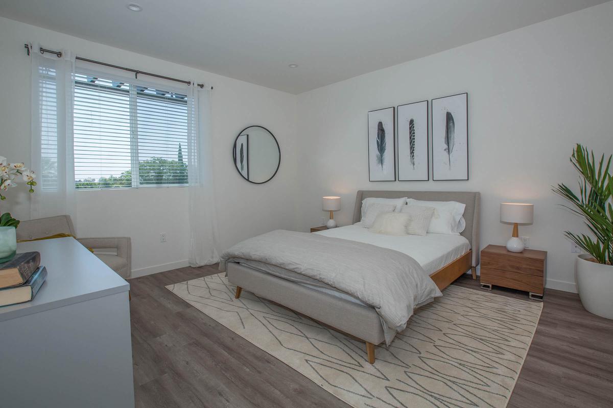 a bedroom with a large bed in a room
