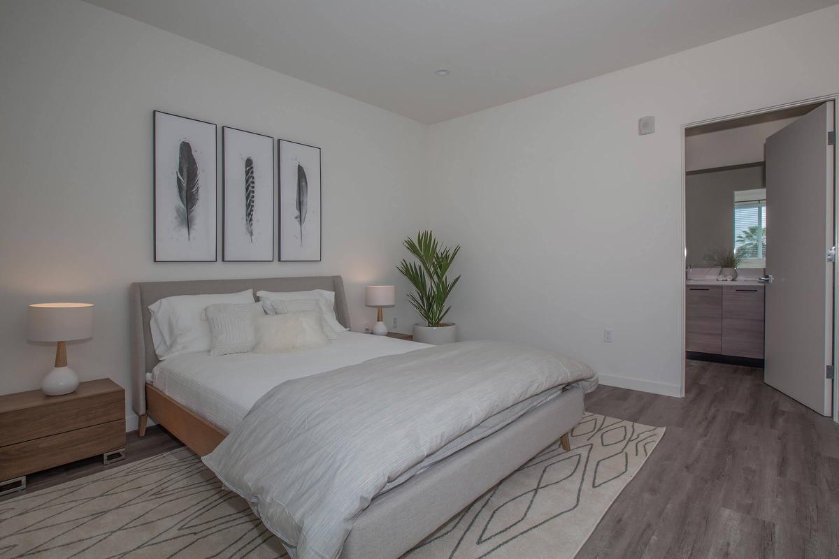 a bedroom with a large bed in a room