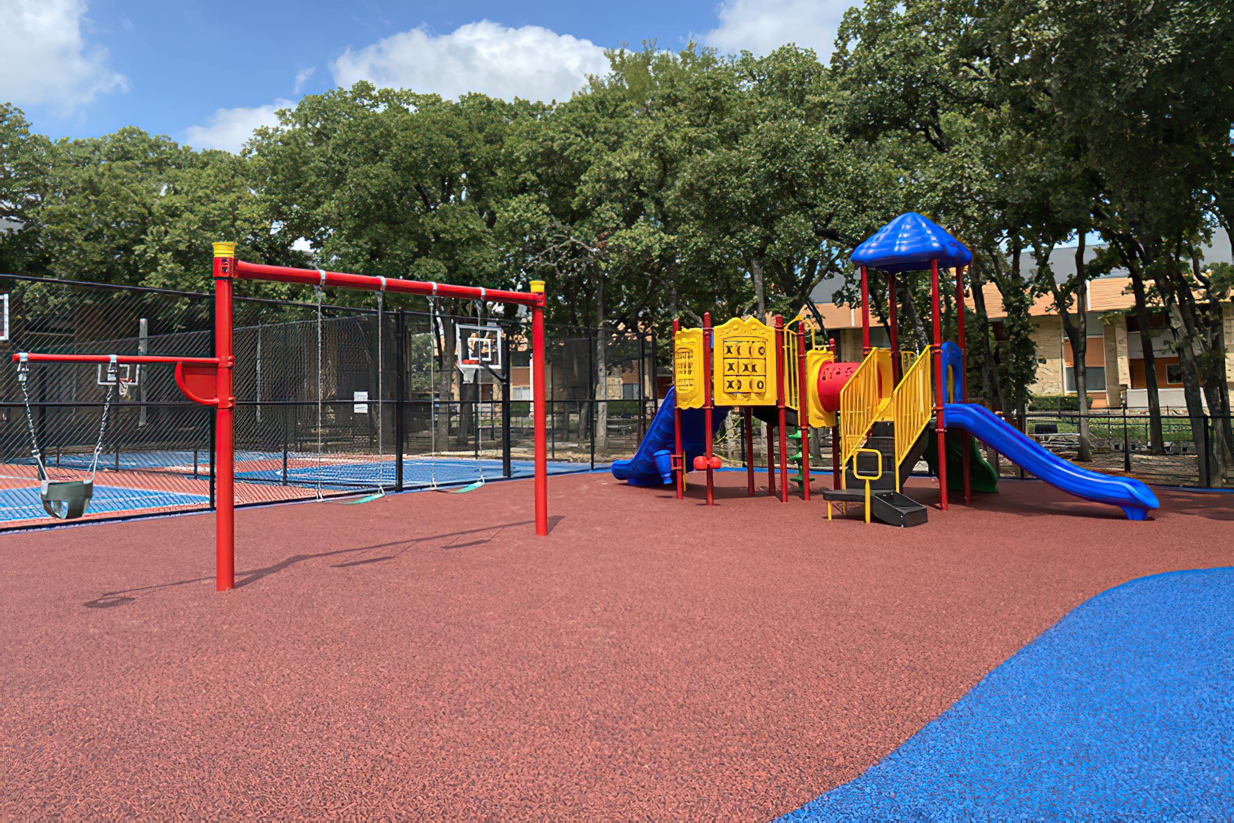 a small child sitting on a playground