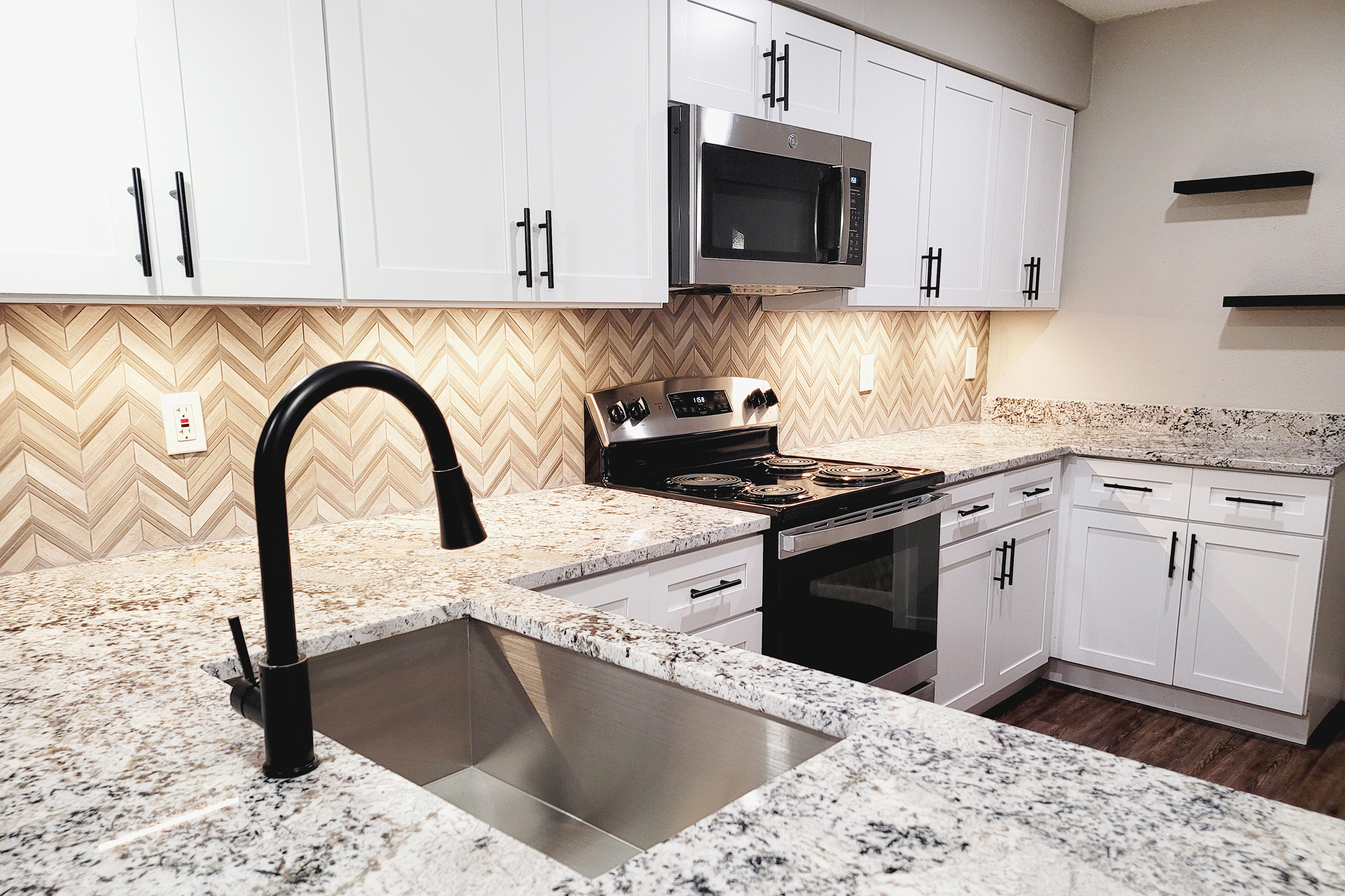 a kitchen with stainless steel appliances and wooden cabinets