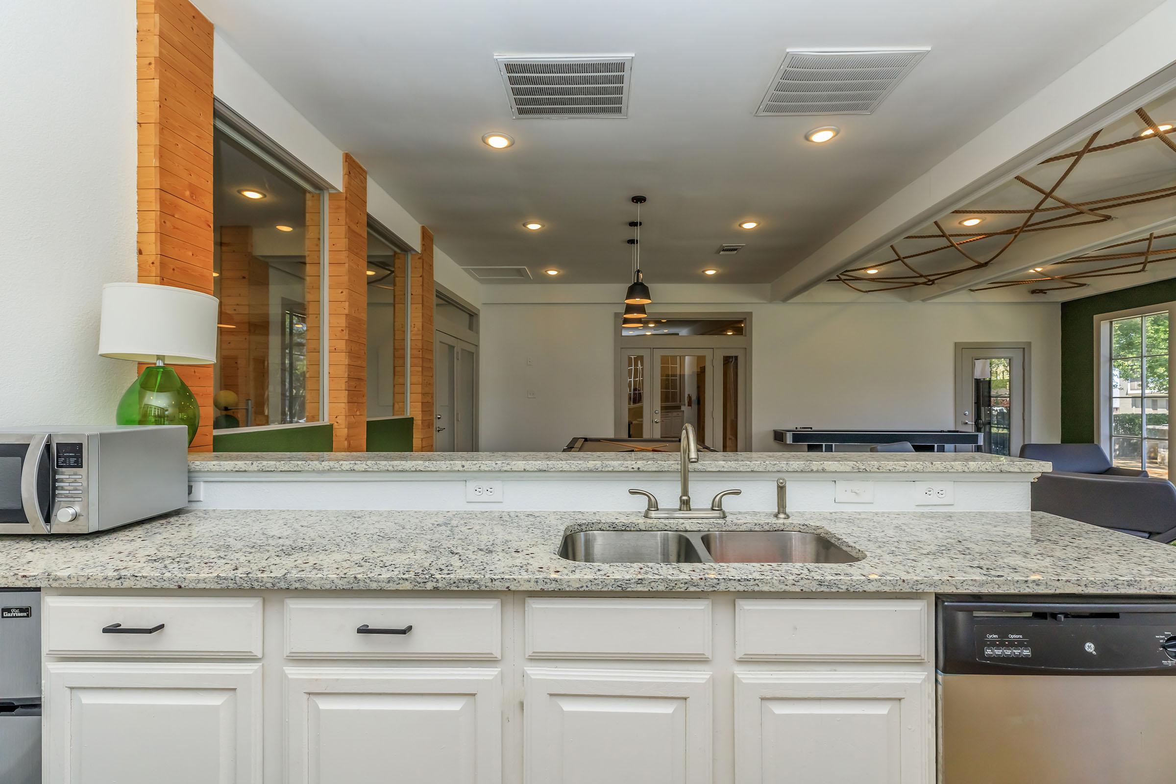 a kitchen with a stove and a sink