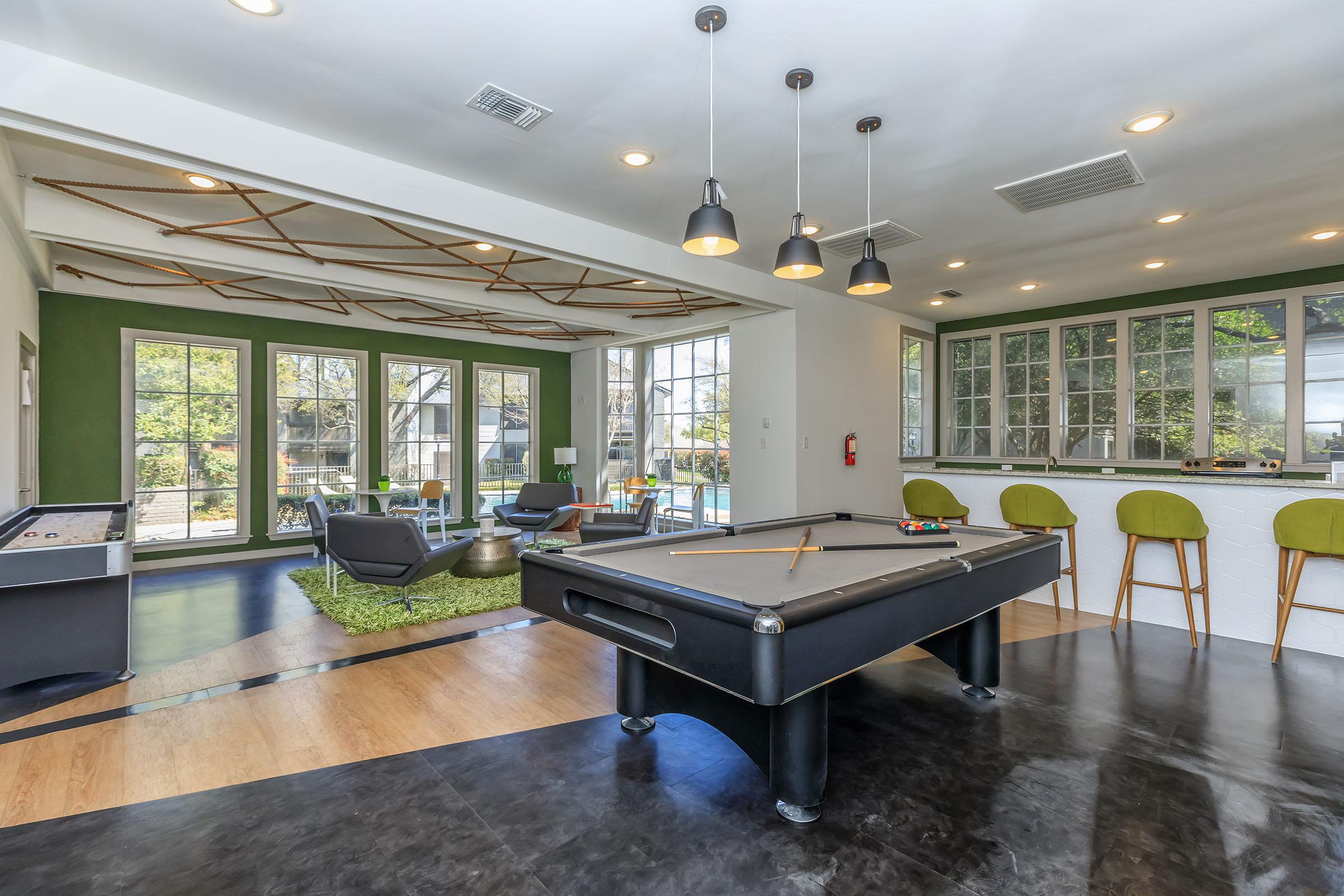 a living room filled with furniture and a large window