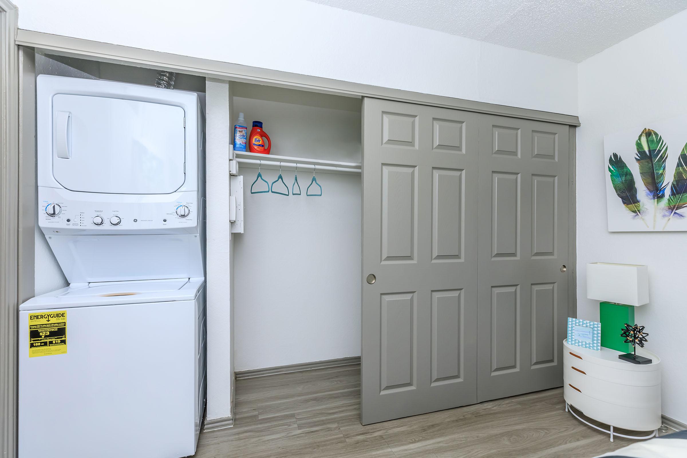 a kitchen with a sink and a refrigerator