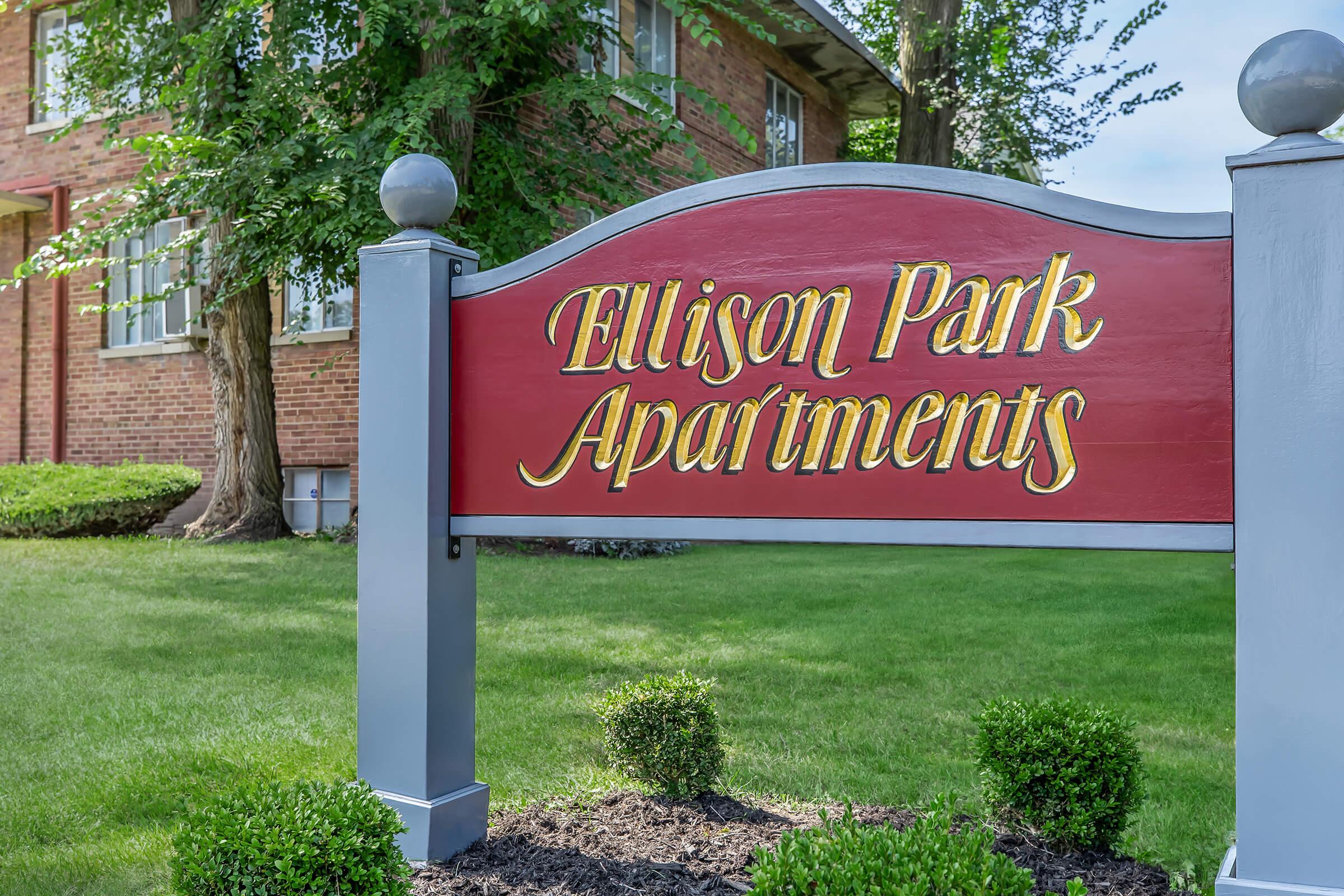 a sign in front of a building