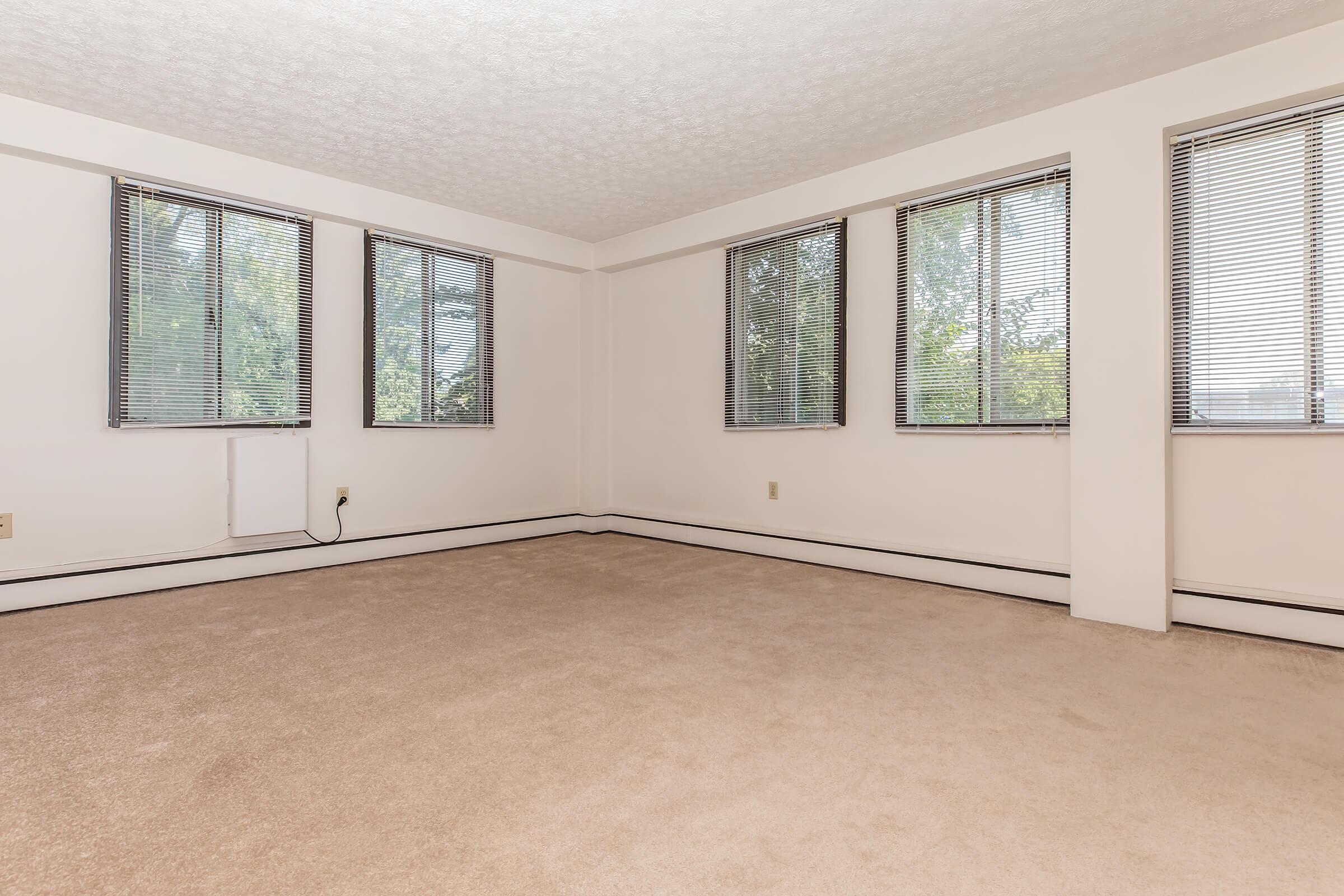 a bedroom with a bed and window in a room