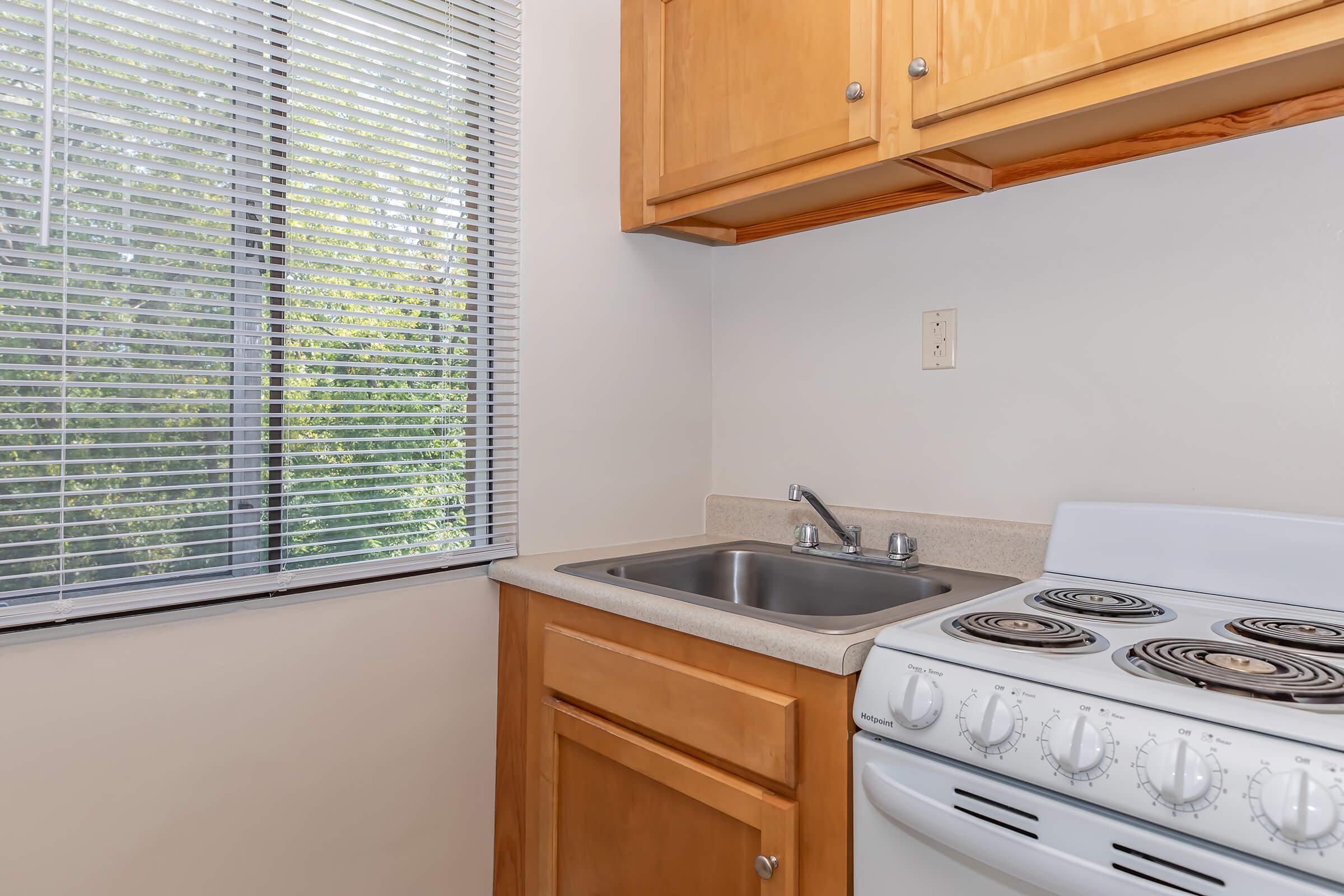 a kitchen with a sink and a microwave