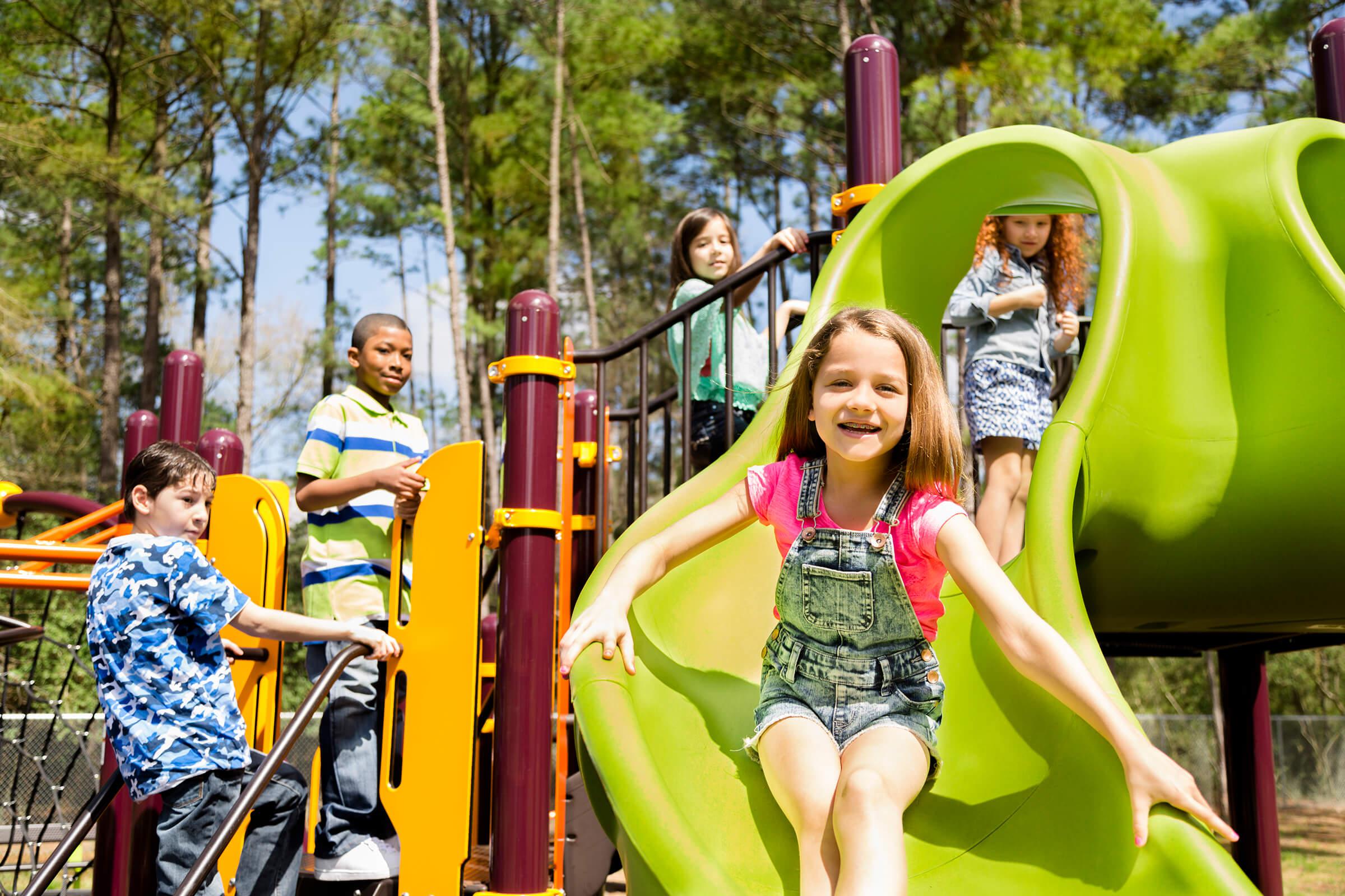 Elementary children play at school recess or park on playground iStock-480629461.jpg