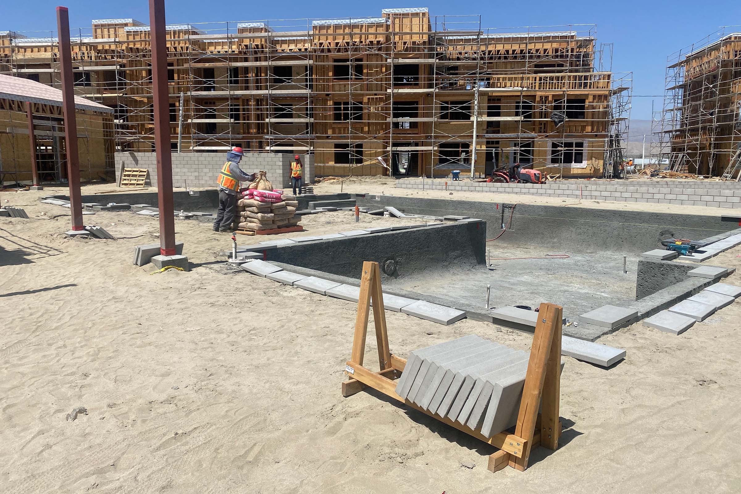 a sandy beach next to the building