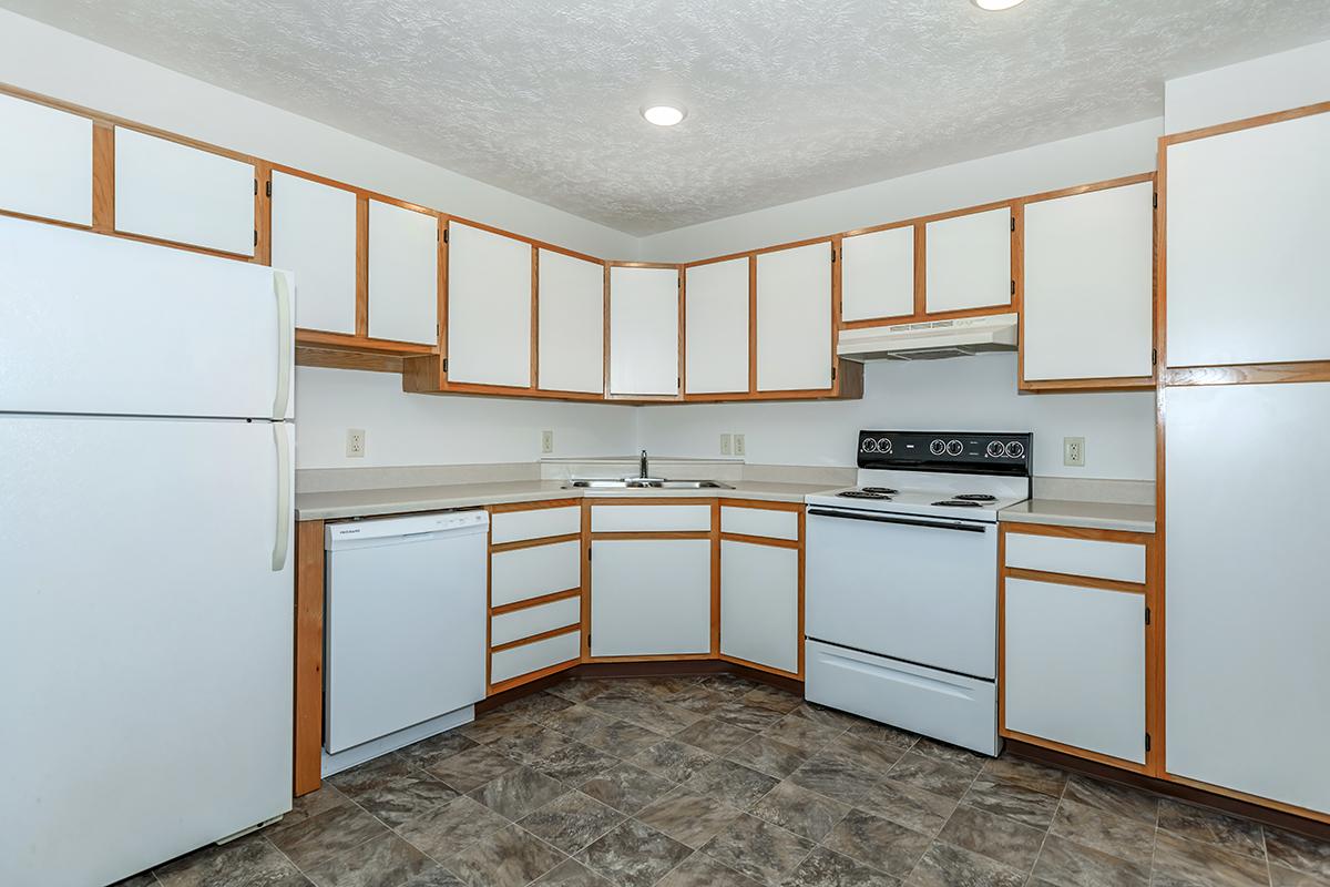 a large white refrigerator in a kitchen