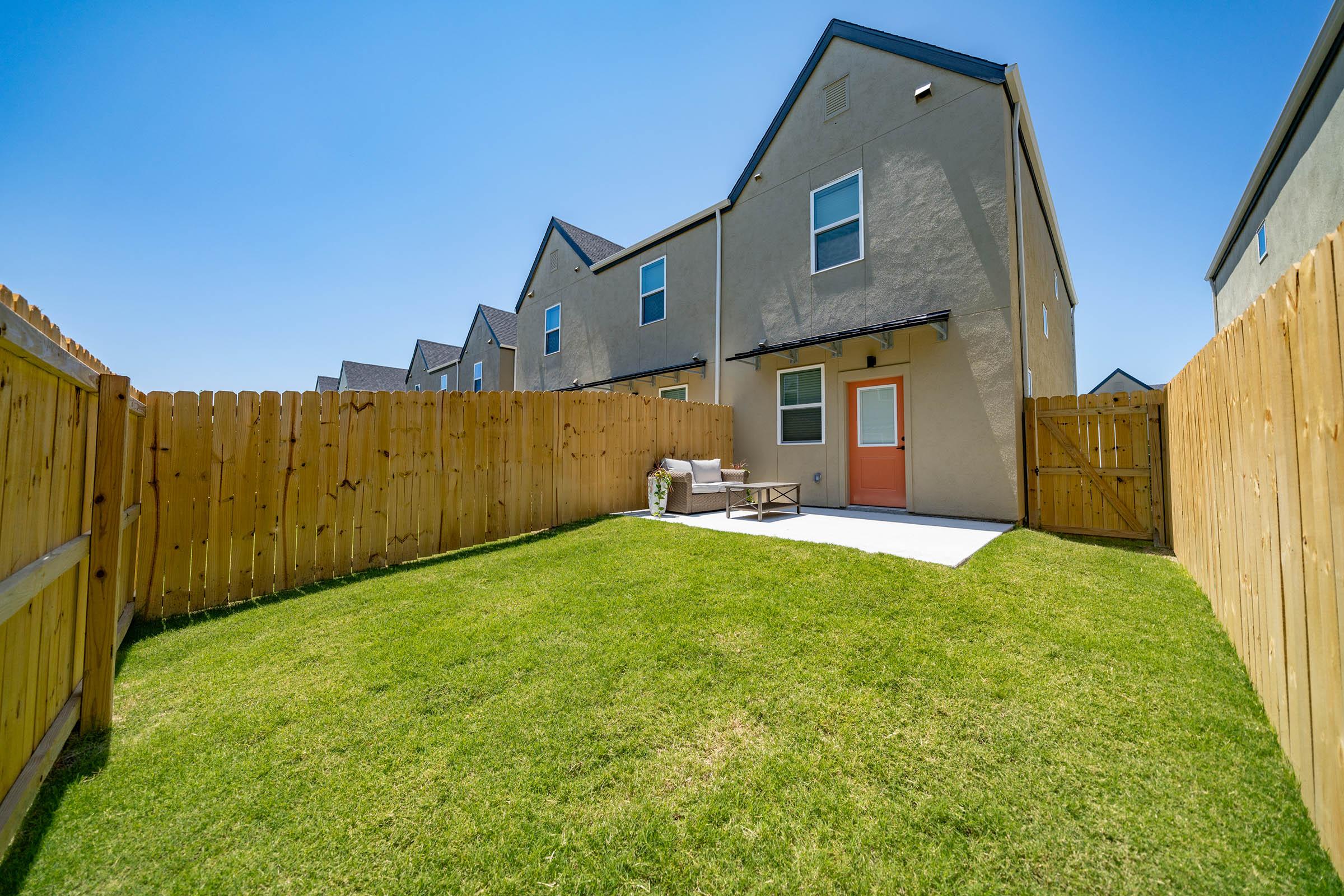 a large lawn in front of a house