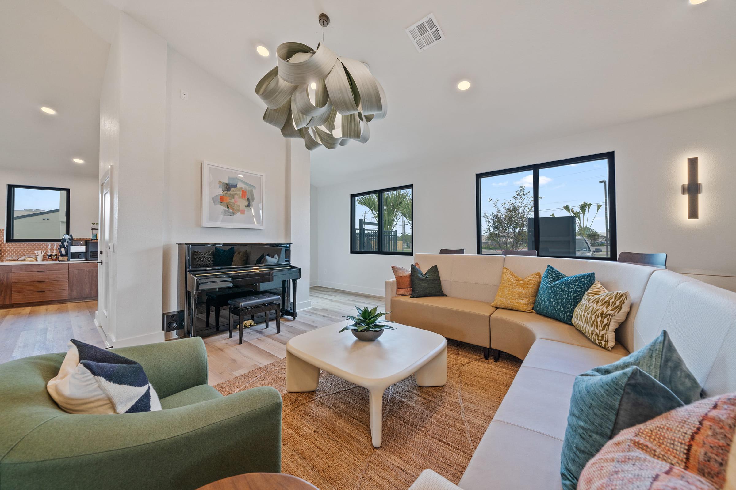 a living room filled with furniture and a large window