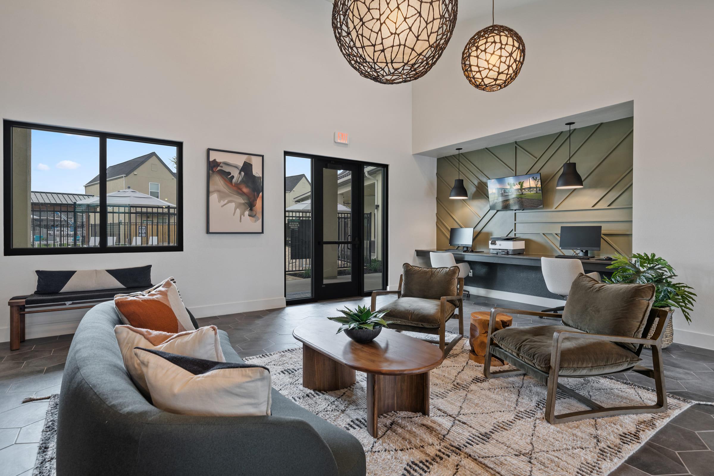 a living room filled with furniture and a large window