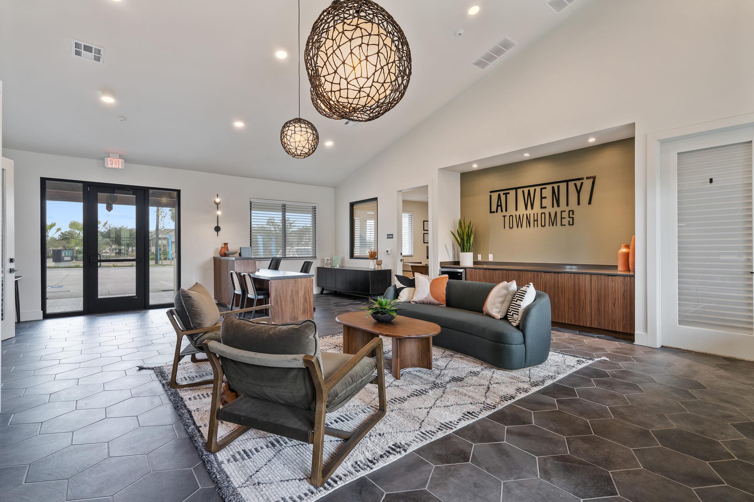 a living room filled with furniture and a large window