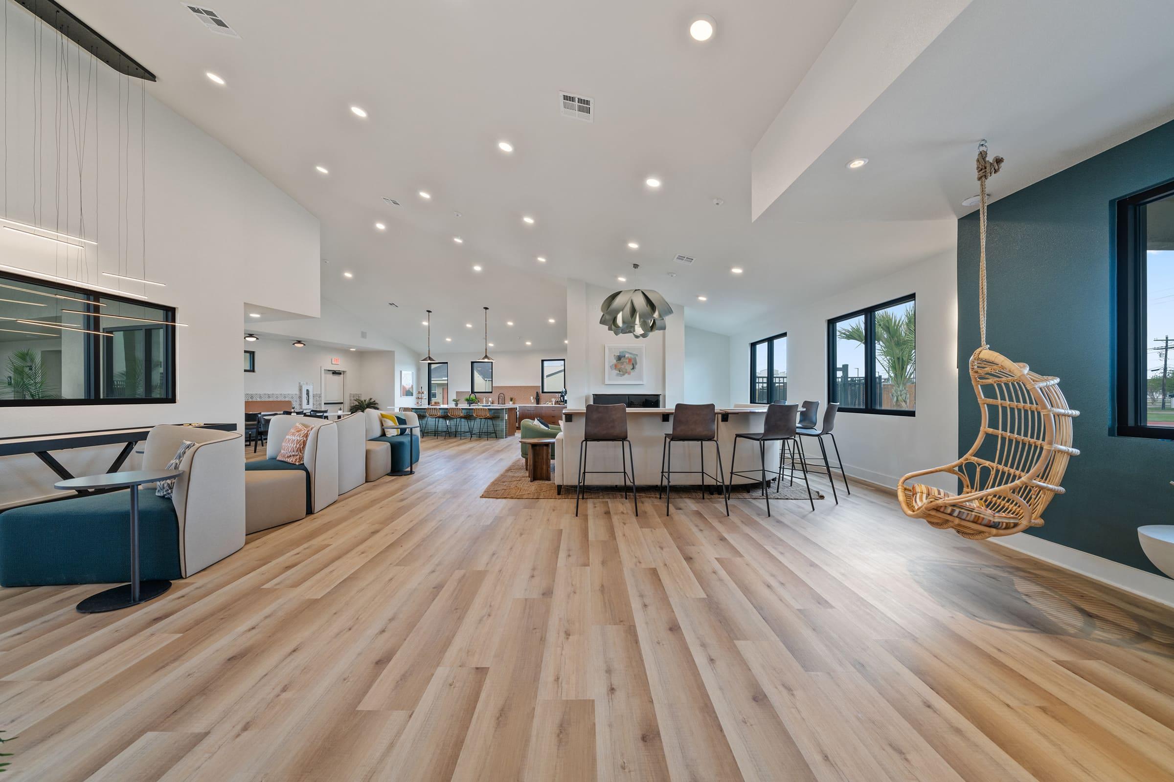 a room filled with furniture and a wood floor